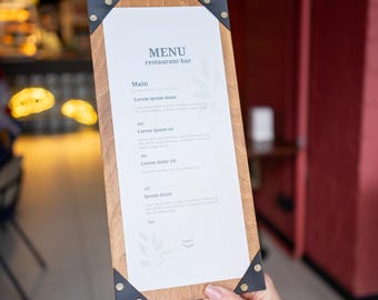 May include: A wooden menu board with a white paper insert listing the restaurant's menu. The menu is titled "MENU restaurant-bar" and lists the following items: "Main", "Lorem ipsum dolor", "Lorem ipsum sit", "Lorem dolor sit", and "Ipsum dolor".