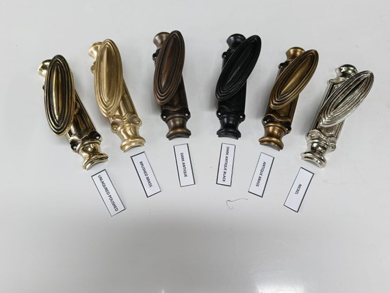 Lot - Eleven brass jamb hooks, including three pairs and five
