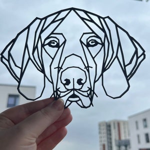 May include: Black and white geometric line art illustration of a dog's head. The dog has large floppy ears and a long snout.