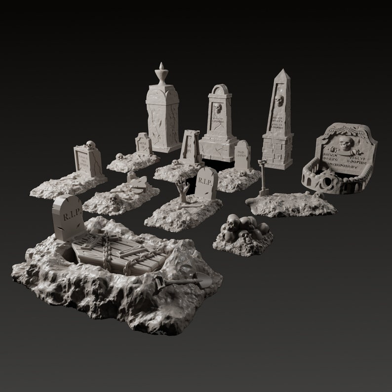 May include: A set of 12 miniature grey painted tombstones and grave markers with various designs, including skulls, crosses, and a coffin. The tombstones are arranged on a grey, textured surface.