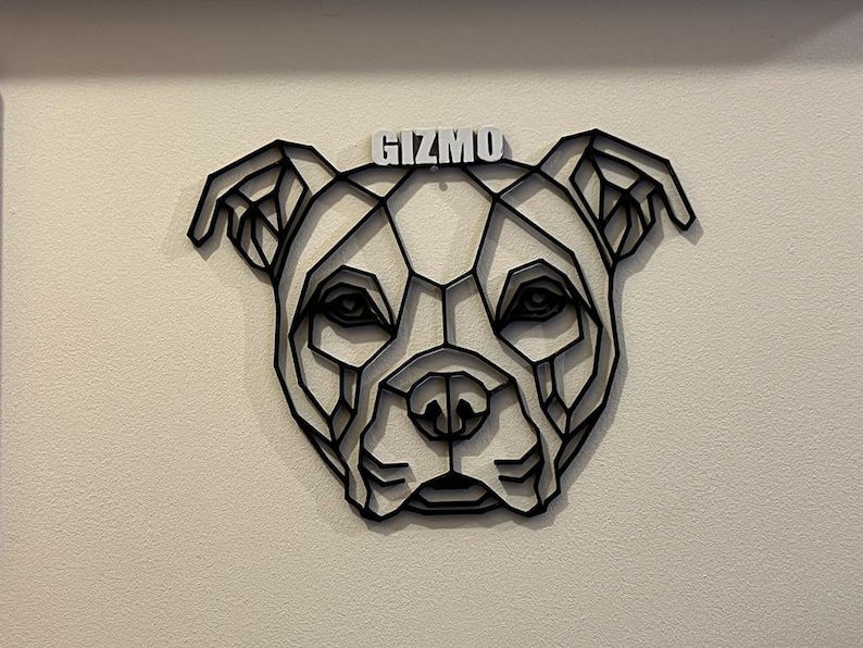 May include: Black geometric dog silhouette wall art with the name "Gizmo" written in white letters.