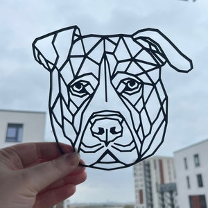 K&ouml;nnte beinhalten: Schwarz-wei&szlig;es geometrisches Design eines Hundekopfes, der einem Pitbull &auml;hnelt.