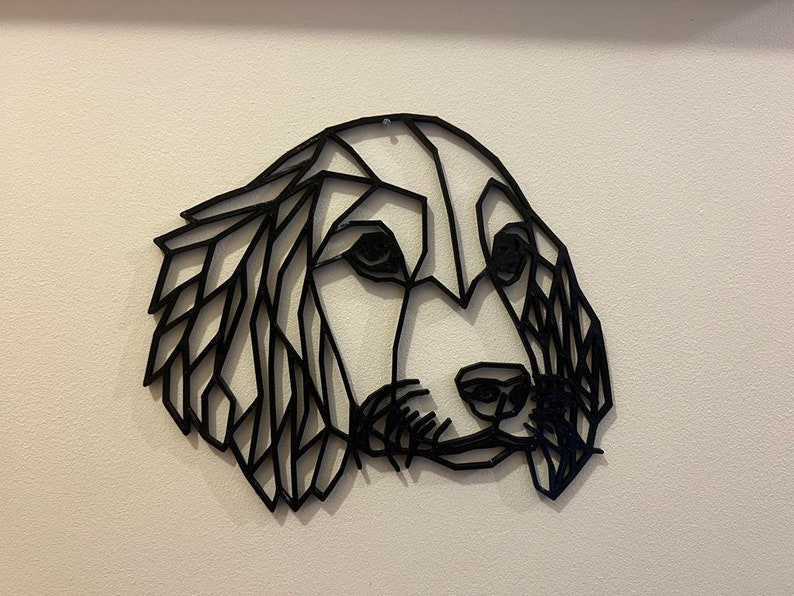 May include: Black geometric silhouette of a dog's head, with a stylised design of the fur and facial features.