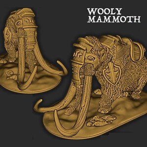 May include: A gold-colored miniature figurine of a woolly mammoth wearing armor and a saddle. The mammoth is standing on a circular base with a textured surface. The text "WOOLY MAMMOTH" is printed in white on a black background.