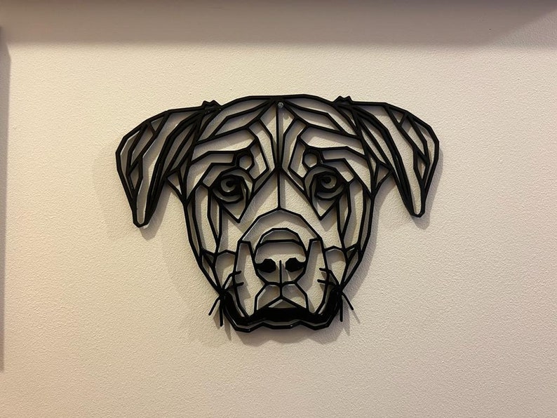 May include: Black and white geometric design of a dog's head. The design is made of many triangles and lines, creating a modern and abstract look.