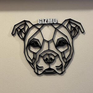 May include: Black geometric dog silhouette wall art with the name "Gizmo" written in white letters.