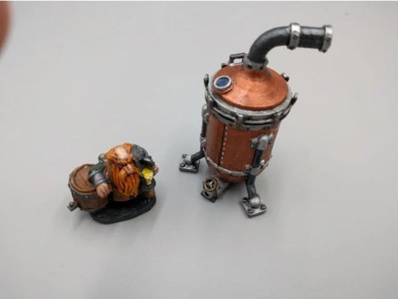 May include: A miniature figurine of a dwarf holding a barrel and a gold coin, standing next to a copper and silver steampunk-style brewing tank with a pipe.