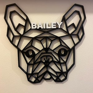 May include: Black geometric silhouette of a French Bulldog head with the name "BAILEY" written in white letters above the dog's head.