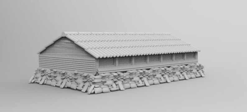 May include: A white model of a traditional Japanese house with a tiled roof and a stone foundation.
