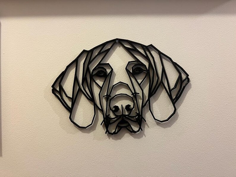 May include: Black and white geometric line art wall decor of a dog's head. The dog's head is made of many triangles and lines, creating a modern and abstract look.