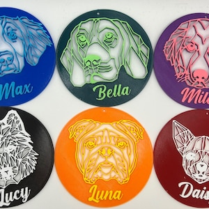 May include: Six round, colorful ornaments with geometric animal illustrations and names. The ornaments are blue, green, purple, black, orange, and red. The animals are a dog, a wolf, a bulldog, and a chihuahua. The names are Max, Bella, Milo, Lucy, Luna, and Daisy.