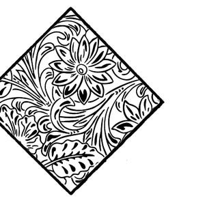 May include: Black and white floral design within a diamond shape. The design features a central flower surrounded by leaves and swirling patterns, all outlined in black against a white background.