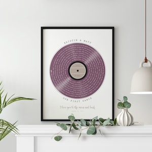 May include: A printable wedding first dance song lyric art print with a purple vinyl record design. The print features the names "Kristin & Matt" and the text "Our First Dance I love you to the moon and back August 20, 2023".