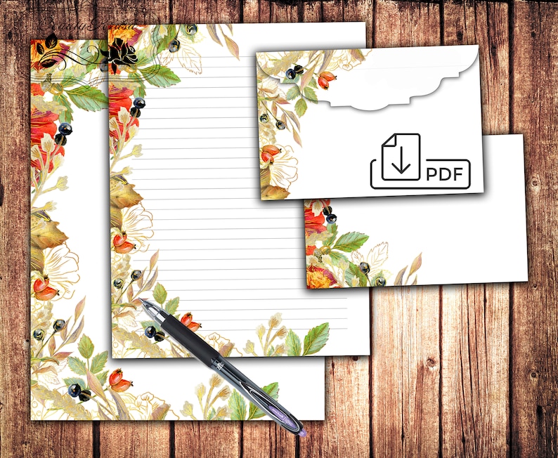 May include: Printable stationery set with a floral design featuring red, orange, and yellow flowers, green leaves, and gold accents. The set includes a letterhead and an envelope. The envelope has a scalloped edge and a download icon with the word "PDF".