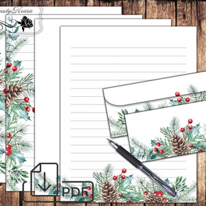 May include: Printable stationery set with a winter holiday theme. The design features pine branches, holly berries, and pine cones in shades of green, red, and brown. The paper has lined writing space and the envelope has a matching design.