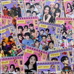 May include: A collection of pink spiral-bound notebooks featuring various K-pop groups and solo artists. The notebooks have colorful designs with images of the artists and the names of the groups. The notebooks are decorated with stickers and other embellishments.