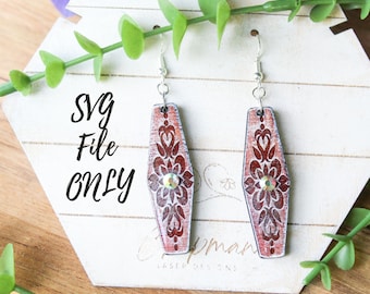 May include: A pair of wooden earrings with a red and white design and a clear rhinestone in the center. The earrings are hanging on a white display stand with the text "SVG File Only".
