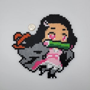 May include: A pixel art character of a girl with black hair, pink and white clothing, and a green mouth guard. The character is holding a sword in her right hand.