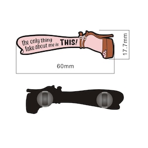 May include: A pink and brown pin with a high heel shoe and the text "the only thing fake about me is THIS!"  The pin is 60 mm wide and 17.7 mm tall.