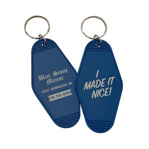 May include: Two blue motel keychains with silver key rings. One keychain says "Blue Stone Manor, Great Barrington, MA, The Fish Room". The other keychain says "I Made It Nice!"