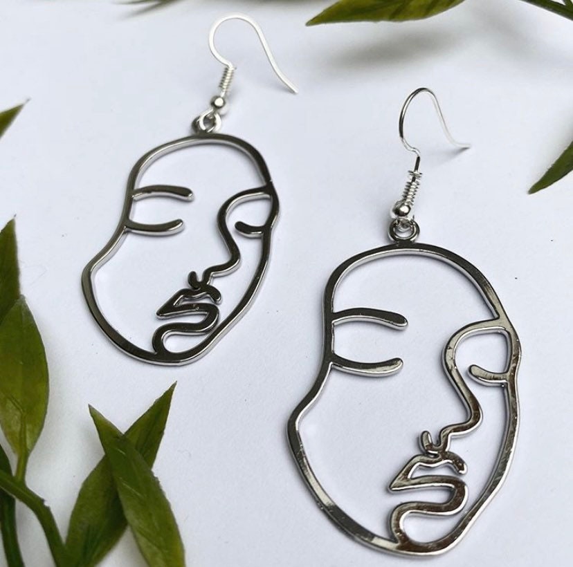 One line face on sale earrings