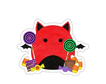 May include: A red and black cartoon bat with wings, holding candy canes and surrounded by candy corn, chocolate, and lollipops.