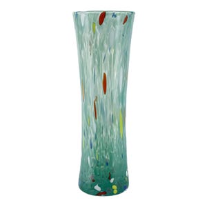 May include: A tall, speckled glass vase with a light green base and body. The vase features colourful flecks of red, yellow, blue, and white throughout its design. The vase is approximately 30 cm tall and tapers slightly towards the top.