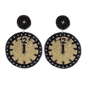May include: A pair of black beaded earrings with gold clock faces. The clock faces have black numbers and hands.