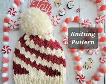 May include: Knitting pattern for a white and red striped hat with a fluffy pom pom. The hat is surrounded by a garland of red and white candy canes.