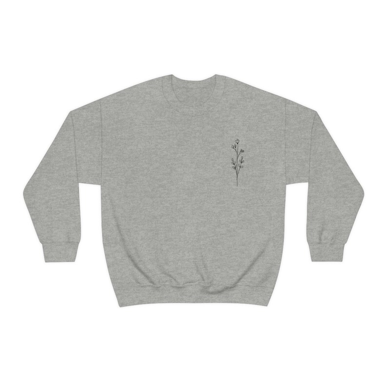 May include: A heather gray sweatshirt with a small black line drawing of a flower on the left chest.