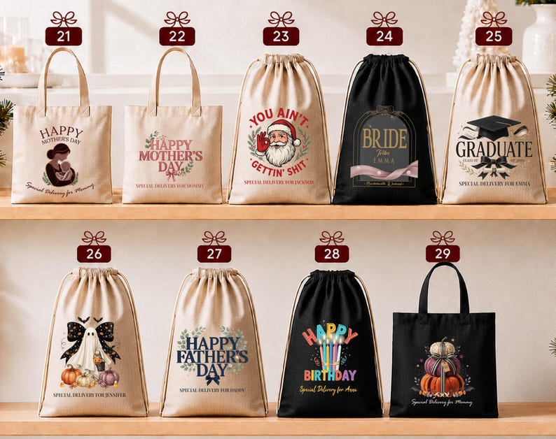 a collection of bags and drawstring bags with various designs and messages, including "Happy Mother's Day", "You Ain't", "Graduate", "Bridal", "Happy Father's Day", and "Happy Birthday".