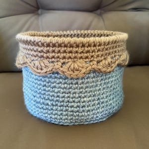 May include: A set of three ceramic mugs with a speckled, matte finish. The mugs are in shades of cream, light gray, and dark gray. Each mug has a simple, minimalist design, perfect for coffee or tea.