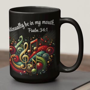May include: Black coffee mug with a colorful musical notes design and the text "Let the words of my mouth and the meditation of my heart be acceptable in your sight, O Lord, my strength and my redeemer. Psalm 34:1"
