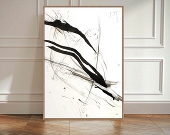 May include: A rectangular wall art piece featuring a white background with bold, sweeping black ink brush strokes. The artwork is enclosed in a thin, light-toned wooden frame, displaying a high-contrast abstract composition of fluid lines.