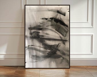 May include: A rectangular framed wall art piece featuring an abstract composition of black and gray ink-like brushstrokes on a white background. The artwork displays varied opacity levels, creating layered, sweeping marks and bold, dark shapes.