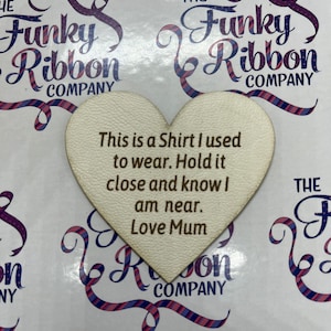 May include: White heart-shaped wooden plaque with the text "This is a Shirt I used to wear. Hold it close and know I am near. Love Mum"