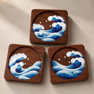 May include: Set of three square wooden coasters. Each coaster features a circular design of a blue and white ocean wave. The coasters have a dark brown wood grain finish. The wave design has a Japanese aesthetic.