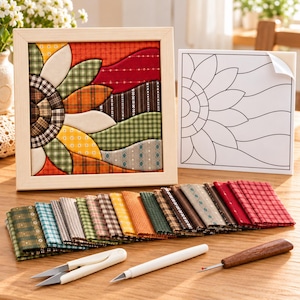 May include: A no-sew quilt kit featuring a framed sunflower fabric panel, a printed pattern guide, a stack of assorted plaid and patterned fabric squares, a pair of white snips, a white craft knife, and a wooden-handled seam ripper tool.