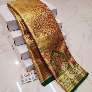 Pure kanjivaram handloom silk sari with running blouse piece .
