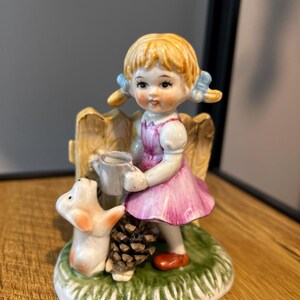 Vintage porcelain figurine of a young girl with pigtails rare