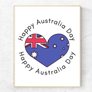 K&ouml;nnte beinhalten: Eine wei&szlig;e Karte mit einer blauen und roten Herzform der australischen Flagge in der Mitte. Der Text "Happy Australia Day" ist in einem Kreis um die Flagge geschrieben.