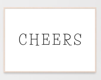 May include: A white framed print with the word "CHEERS" in black text.