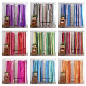 May include: A collage of nine images showcasing various colorful patchwork curtains. Each curtain panel features a unique combination of stripes and patterns in vibrant hues like purple, red, green, blue, pink, and orange. The curtains are hung on a window with a small side table and a potted plant in front of each.
