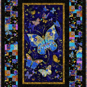 May include: A quilt with a black background and a gold frame. The center of the quilt features a large blue butterfly with intricate details. The butterfly is surrounded by smaller butterflies in various colors. The quilt is made up of patchwork squares with different patterns and colors.