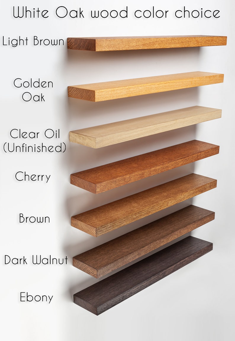 May include: Image showcasing a selection of White Oak wood color choices. The options include Light Brown, Golden Oak, Clear Oil (Unfinished), Cherry, Brown, Dark Walnut, and Ebony. Each color is displayed on a rectangular shelf.