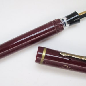 Vintage 1960s German Rio Edelstahl 14 Gleitspitze piston filler, dark red fountain Pen.