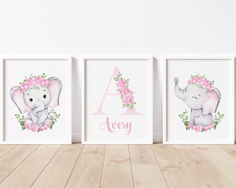 May include: Three framed prints with a pink and gray elephant design. The center print features the letter A with pink flowers and the name Avery. The prints are perfect for a nursery or child's room.