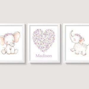 May include: Three framed prints featuring a cute elephant with a purple flower crown. The middle print has a heart shape made of purple flowers and the name "Madison" written below it.