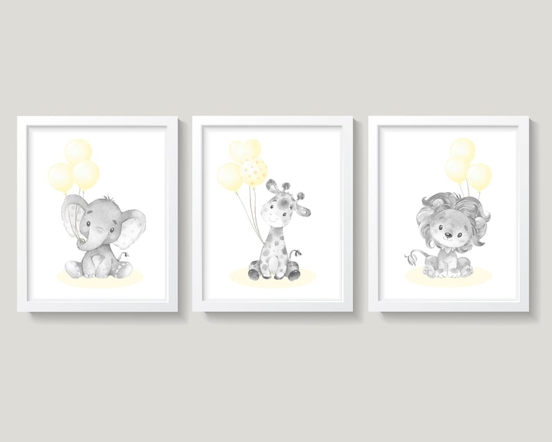 May include: Three framed prints featuring a gray elephant, giraffe, and lion holding yellow balloons. The animals are illustrated in a watercolor style.