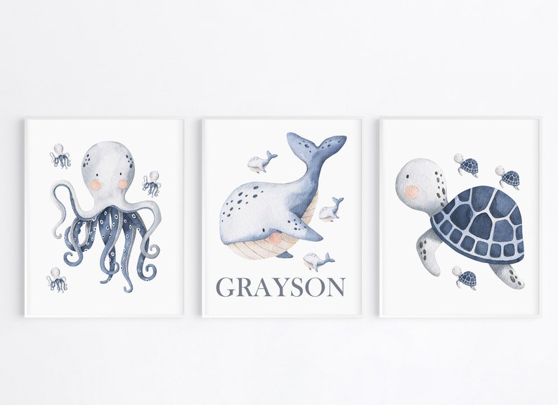 May include: Three watercolor illustrations of sea creatures. The first shows a blue octopus with eight tentacles. The second shows a blue whale with a light blue belly and the name Grayson. The third shows a blue sea turtle with a light blue shell.